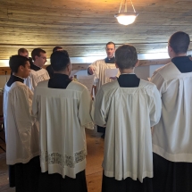 Fr. Sandquist directing the choir for the Requiem Mass